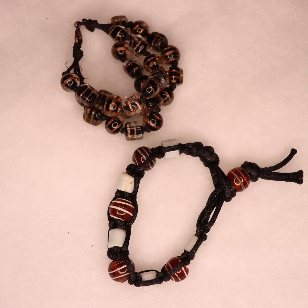 Set of two corded beaded braided bracelets in brown earth tones